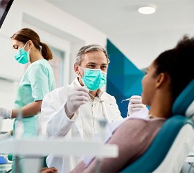 Dentist treats patient