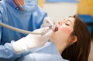 Woman relaxing with sedation dentits, Dr. Banda.