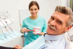 Smiling patient with dentures