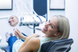 Woman having dental checkups with dentures.