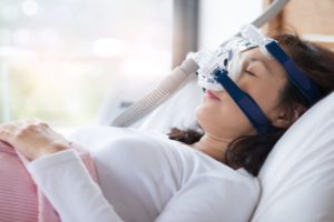 Woman wearing a CPAP for sleep apnea