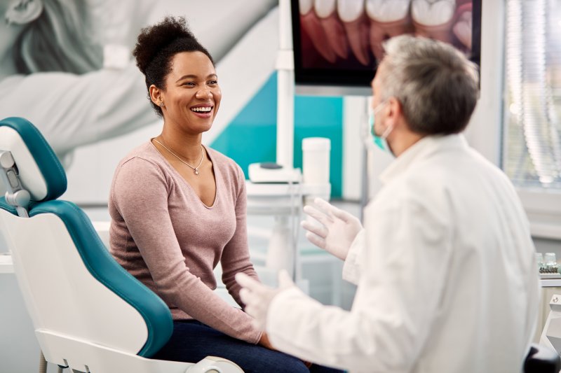 dentist talking to patient on National Dentist's Day