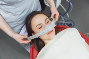 Young woman receiving sedation dentistry.