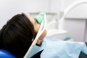 Patient receiving sedation at dentist. 